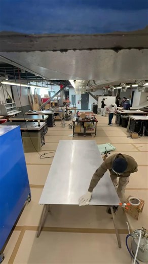 #TeachMeTuesday Timelapse of vacuum infusion in action! Vacuum infusion is a closed-mold composites manufacturing process where vacuum pressure draws liquid resin through dry fiber reinforcements—like fiberglass or carbon fiber—inside a sealed mold. The result? Strong, lightweight parts with precise fiber-to-resin ratios, minimal voids, less waste, and improved environmental performance compared to traditional layup methods. Hands-on learning at its best. 👊 *Watch 'til the end when the resin ma