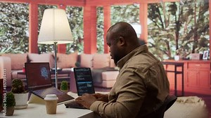 Software engineer coding on a laptop focusing on deep learning, database management and binary code to develop next generation AI solutions and interfaces. Database processing. Camera B.