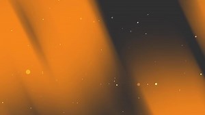 Download Orange and black gradient background with small light spots. for free