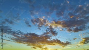 A Beautiful Gradient of Colors of Sunset Sky with Clouds and Camera Panning left to right