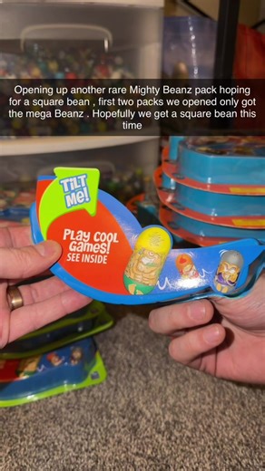 I accidentally said we only opened up two packs so far, but it’s actually three. So what I meant to say was … opening up a third rare mighty beanz pack, hoping for a square bean.