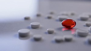 White Round Tablets One Red Center Stock Footage Video (100% Royalty-free) 1100739555 | Shutterstock