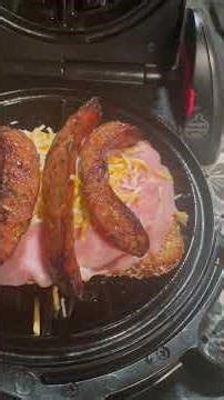 Ham cheese and sausage sandwich on the waffle maker