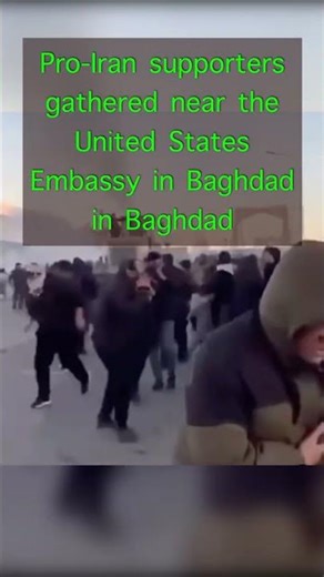 protesters described as pro-Iran supporters gathered near the United States Embassy in Baghdad