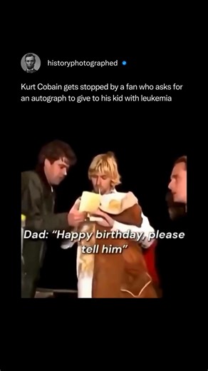 During the 1992 Reading Festival, a fan and his young son, whom the father claimed had leukemia, met Kurt Cobain backstage to get an autograph. Cobain engaged warmly with the boy, signed a piece of merchandise, and shared a piece of advice. | History In Pictures