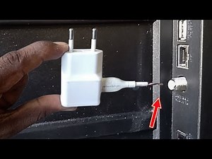 Put your cell phone charger behind the TV and see what appears on the screen