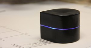 This miniature robotic printer rolls across a sheet of paper