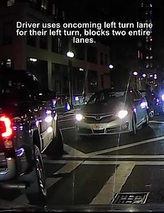 Driver uses oncoming left turn lane for their left turn, blocks two entire lanes. | Dashcam Lessons