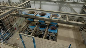 Production line sorts and filters mineral materials at industrial plant. Automated mechanism transports different ore to special containers