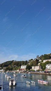 Looe Cornwall England UK. 29.09.2024. Video. View from Looe bridge across the incoming tide on River Looe to East Looe. UK