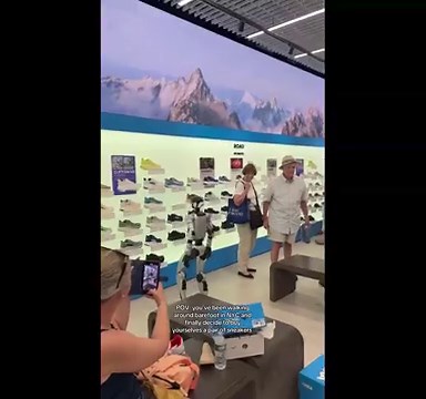 Humanoid robot tries on sneakers at Manhattan store