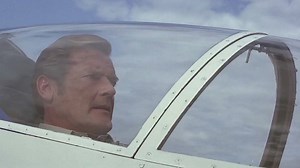 Sir Roger Moore at the controls of the Acrostar mini jet in OCTOPUSSY. | James Bond 007