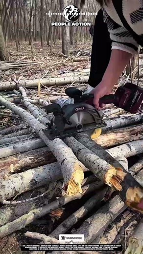 People Cutting Small Logs Using Circular Saw During Forest Work Action