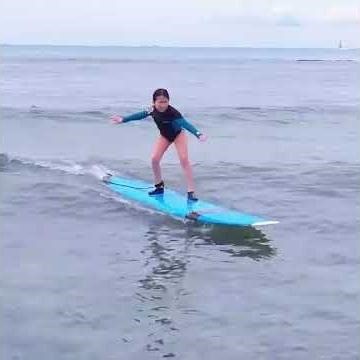 Two Girls Having Fun During a Surfing Lesson!