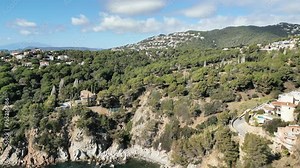 Aerial panoramic view, houses on the mountains with green pine trees in the mediterranean forest, 4K