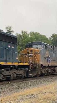 CSX SD40 #8840 leads train M427 with Concrete covered #596 and Tier 4 #3276