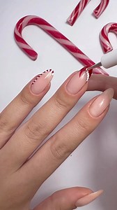 A manicure fit for Christmas Day 🎄💅 @naileditbeauty creates the cutest candy-cane-inspired nail art 😍 #MyMarks Leighton Denny High Performance Nail Colour – https://bit.ly/3hOsTBh Nails Inc Choose Plant Nail Polish Duo – https://bit.ly/3jlPgOP Leighton Denny Crystal Finish Quick Dry Top Coat – https://bit.ly/3Wtm9aG | Marks and Spencer