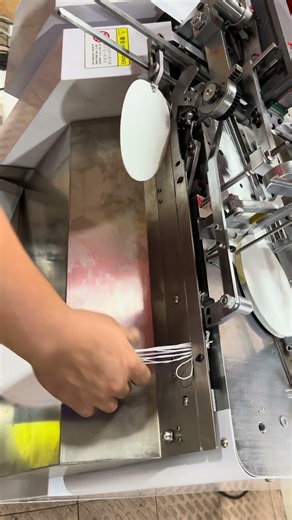 Automatic Paper Tag Threading Machine for Combining Two Tag Together