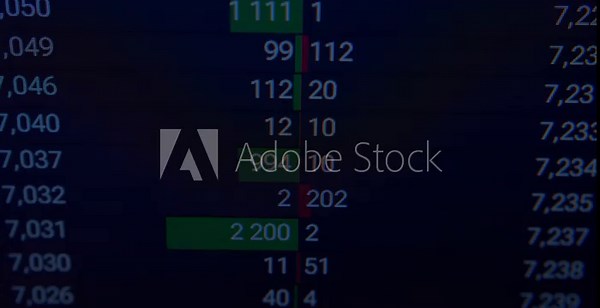 Economic metrics dynamically update on a computer monitor, providing insight into sophisticated online asset management.