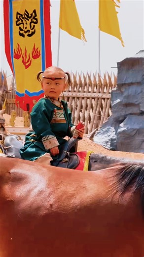 🔥 The Lollipop-Sucking Prairie Wolf Cub! On the grasslands of Hangjin Banner, Ordos, this little boy rides like the wind 🏇 with a gaze fiercer than the steppe winds. Born to ride—his wild spirit leaps off the screen! The freedom and cool of a grassland kid… totally stole my heart! | Discover Ordos