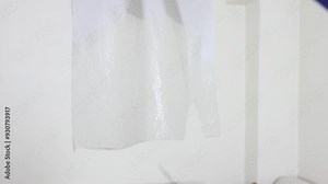 Testing barber scissors on dry and wet paper before and after sharpening. Scissor Sharpness Test. The man sharpens the scissors. Small business. 4K Video.