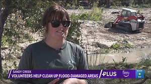 Volunteers clean up flood-damaged areas in Sandy Creek