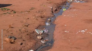 Effluent water flowing from portable toilets in a squatter camp during lockdown for Covid-19 Coronavirus pandemic