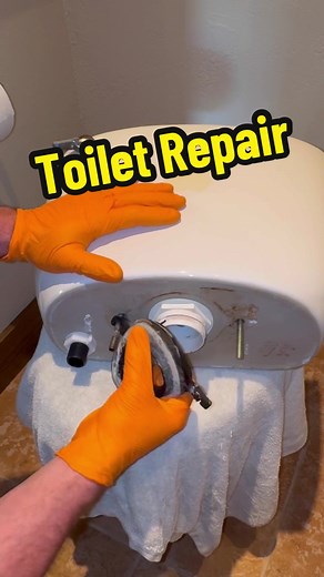 Repairing a toilet that was leaking from the tank when flushed by replacing all of the parts for the tank. #plumbing #plumber #trades #repair #fyp #viral #longervideos