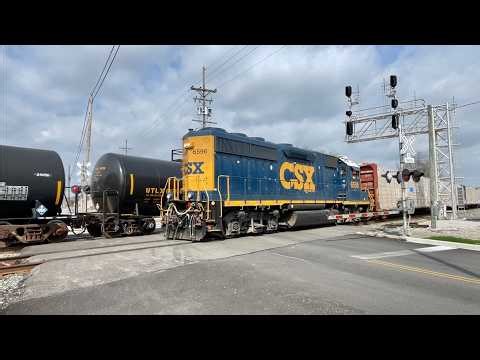 2 Trains Passing At 3 Track RR Crossing, Train On Curve In Front Of Depot, CSX Heritage Unit In Ohio