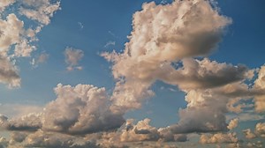 Timelapse of clouds moving across a blue sky - Free Stock Video