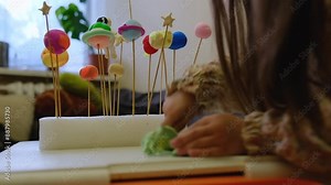 Solar system model hanging over the kid bed. DIY activity for children concept. Selective focus.