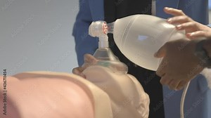 A Man's Hand Ventilates A Dummy With A Bag Valve Mask