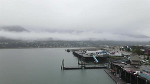 Juneau Alaska with harbor and city in frame aerial