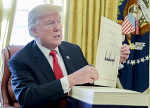 Trump signed the tax bill — here's how it will hit your paycheck in 2018