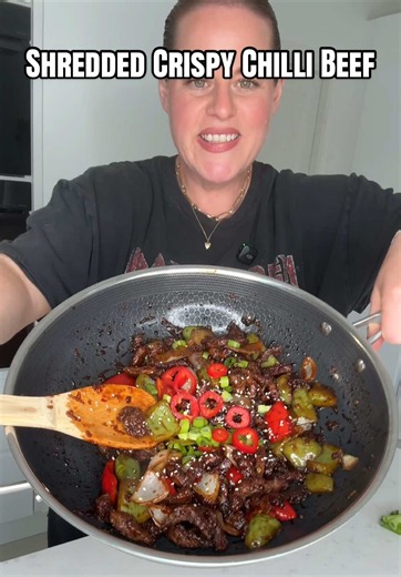 My husband loved this so much!! Shredded Crispy Chilli Beef Ingredients 500g striploin steak, sliced as thinly as possible into strips 3 tbsp cornflour ½ tsp Chinese five-spice powder Pinch of salt Pinch of white pepper For the sauce: 2 tbsp light soy sauce 2 tbsp dark soy sauce 4 tbsp sweet chilli sauce 2 garlic cloves, minced 1 inch fresh ginger, peeled and grated 1 tbsp honey 2 tbsp rice vinegar (or any vinegar) 1 red pepper, sliced 1 green pepper, sliced 1 onion, sliced To garnish 1 red chil
