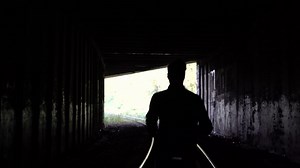 4k Lost Man Silhouette Runs To Dark Tunnel Stock Footage SBV-320613153 - Storyblocks