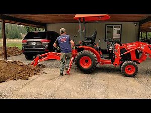 Kubota B2301 & BH70 backhoe digging in a french drain.