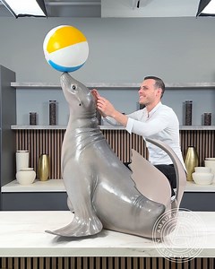 2.1M views · 58K reactions | This chocolate Sea Lion is quite playful, crafted entirely from 100% edible chocolate. This sculpture perfectly balances a beach ball on top of its nose, my favorite part are the pulled sugar whiskers, and the beach ball. Balancing an heavy object on the tip of the nose, was much harder than I thought it would be... | Amaury Guichon | Facebook