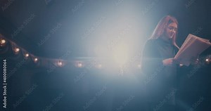 Young actress reading script with director