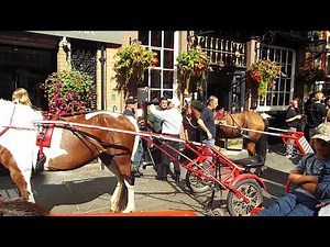 Irish travelers on horses visit a pub in London for a few beers