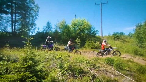 Trio of Bikers Perform Stunts on Dirt Bikes