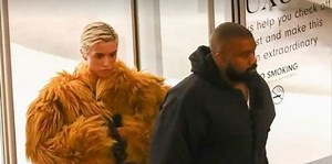 Kanye West sports matching see-through raincoats with his wife in latest risque fit