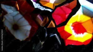 Footage of crystals growing in a time-lapse, showing the mesmerizing process of mineral formation deep within the Earth, with colorful and geometric shapes emerging.