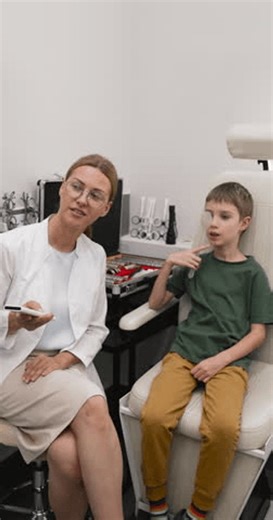 clip-3942781809-optometrist-conducting-visual-acuity-test-little-boy