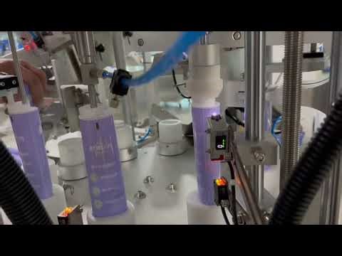 Auto tube filling and sealing machine