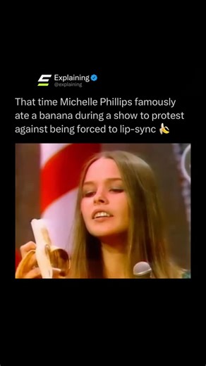 Explaining on Instagram: "During a live performance in the 1960s, Michelle Phillips of The Mamas & the Papas made a bold and unforgettable statement on stage. 🎤🍌 Frustrated with being forced to lip-sync instead of singing live, she deliberately ate a banana mid-performance, making it impossible to hide that the vocals weren’t real. The move instantly broke the illusion and caught the audience’s attention. 😳📺 The moment became legendary as a quiet act of rebellion against the restrictive rule