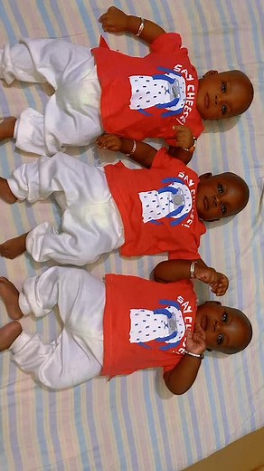 Adorable Infants in Matching Outfits Say Cheese