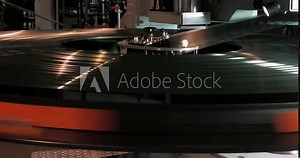 Huge 70mm IMAX film print spins as the film is fed into the projector.