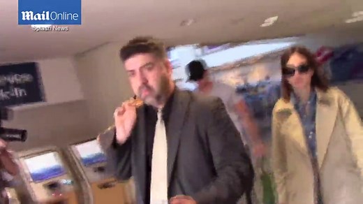 Alexander Skarsgard arrives at LAX with girlfriend Alexa Chung