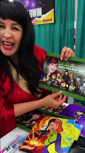 Grey DeLisle shows off her many voices at her table